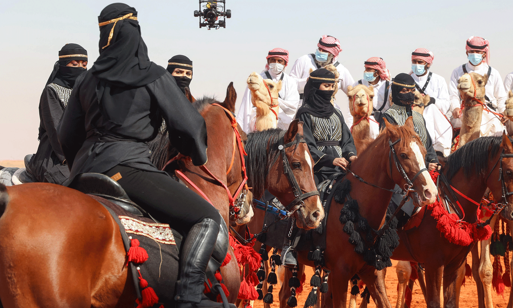 alt="Saudi Traditional Costumes Mesmerize Foreign Visitors at Camel Pageant"