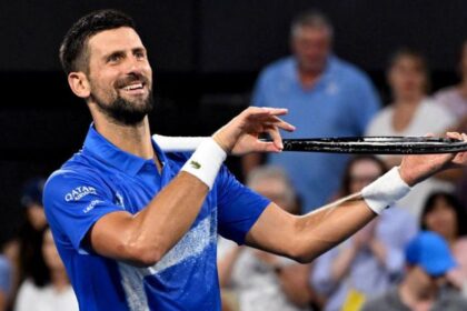 alt="Towering American Opelka Overpowers Novak Djokovic in Brisbane"