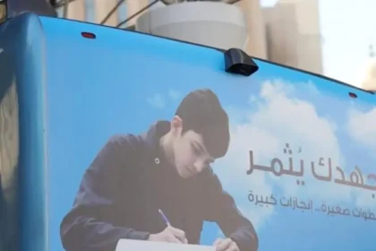 alt="meta description: Kuwait Buses Feature Motivational Signs to Inspire Students."