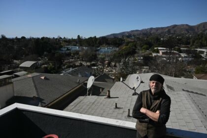 alt="Stubborn' Janitor Refuses to Leave Los Angeles Fire Zone, Camps Amid Rubble"