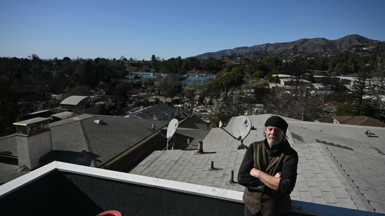 alt="Stubborn' Janitor Refuses to Leave Los Angeles Fire Zone, Camps Amid Rubble"