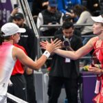 alt="Swiatek and Alexandrova in Doha Semi-Finals"