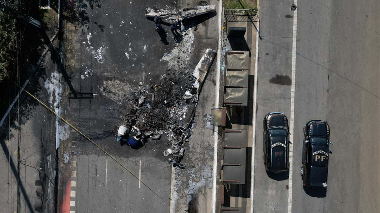 alt="Tragedy in Brazil: Plane Crashes Into Bus on Sao Paulo Street, Killing Two"