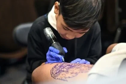 alt="9-Year-Old Thai Tattoo Prodigy Turns Passion for Art Into Craft"