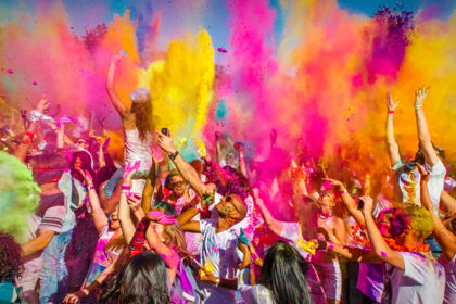 alt="Varanasi Celebrates Holi with Colors and Music"