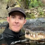 alt="Courageous or Mad? Man Hand-Feeds Giant Crocodile Like Pet"