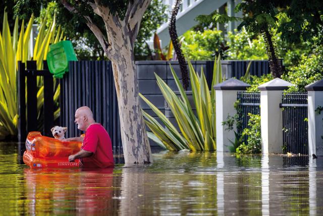 alt="Australians Rescued Off Rooftops as Fatal Floods Displace Thousands"