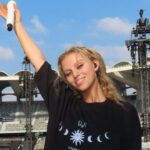 alt="Elyanna Supports Post Malone at Thrilling Abu Dhabi Grand Prix 2025 Performance"