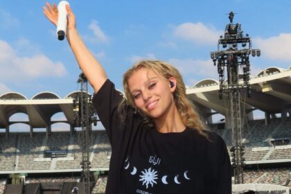 alt="Elyanna Supports Post Malone at Thrilling Abu Dhabi Grand Prix 2025 Performance"