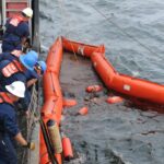 alt="Navy, Coast Guard Race to Avert Environmental Disaster"