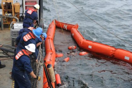alt="Navy, Coast Guard Race to Avert Environmental Disaster"