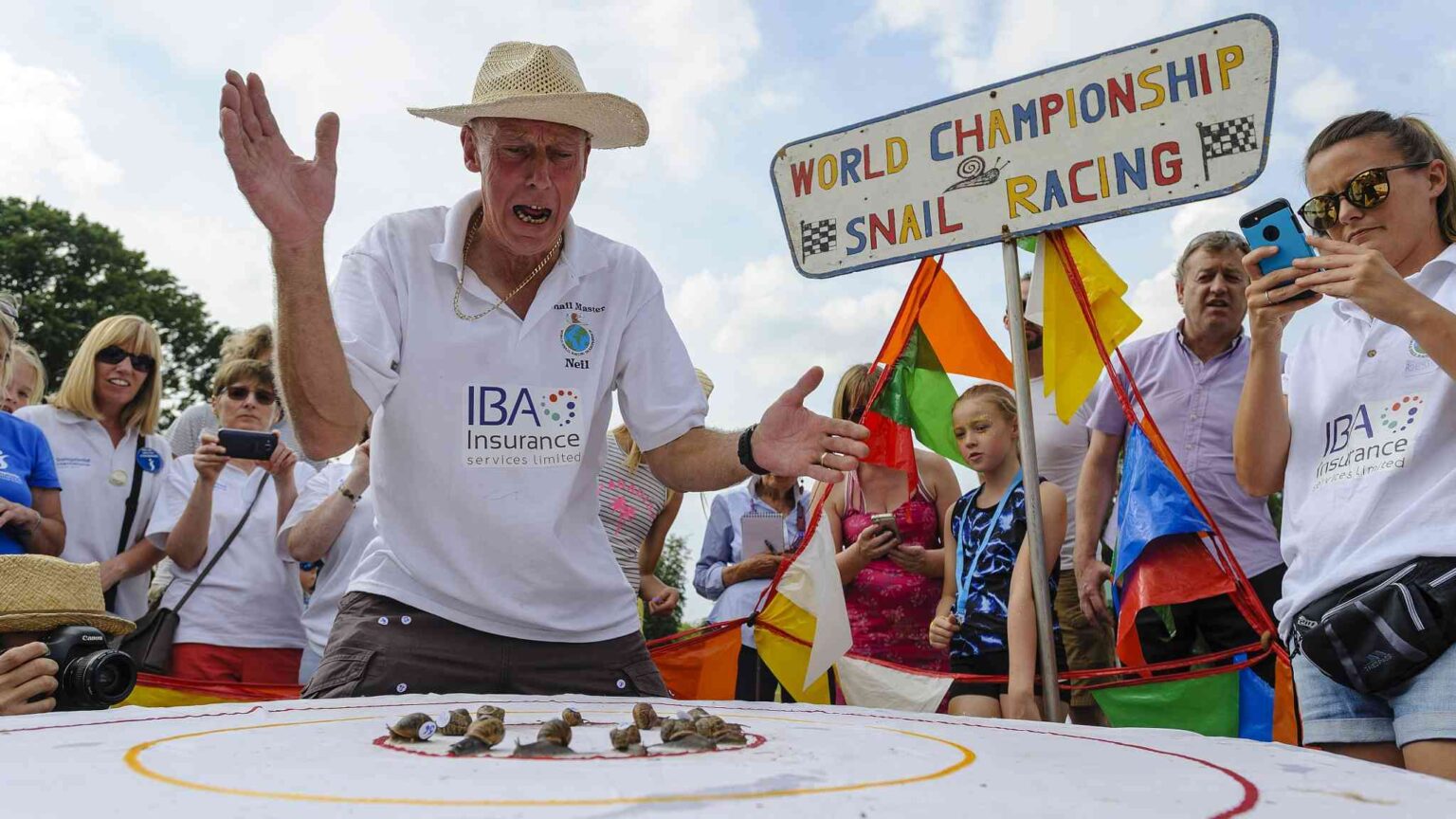 alt="Once again, Slow & Steady triumphs in the quirky snail racing championship held in a UK village"