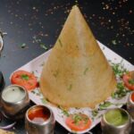 alt="The incomparable South Indian morning combination of dosa, vada, and filter coffee"