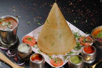 alt="The incomparable South Indian morning combination of dosa, vada, and filter coffee"