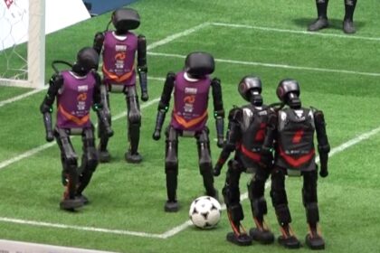 alt="In China's First AI Match, Robot Football Players Fight—Tumbles and Injuries Occur"