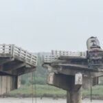 alt="13 people are killed when a bridge collapses in Gujarat"