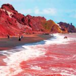 alt="rain-turns-irans-hormuz-island-seas-bright-red-in-surreal-natural-display"