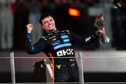 alt="lando-norris-celebrates-f1-title-in-abu-dhabi"
