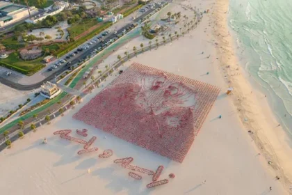 alt="uae-flag-portraits-of-zayed-and-rashid-fly-high-for-eid-al-etihad"