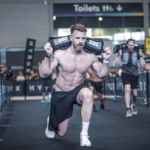 alt="hyrox-is-an-8k-race-mixed-with-challenging-workout-stations"